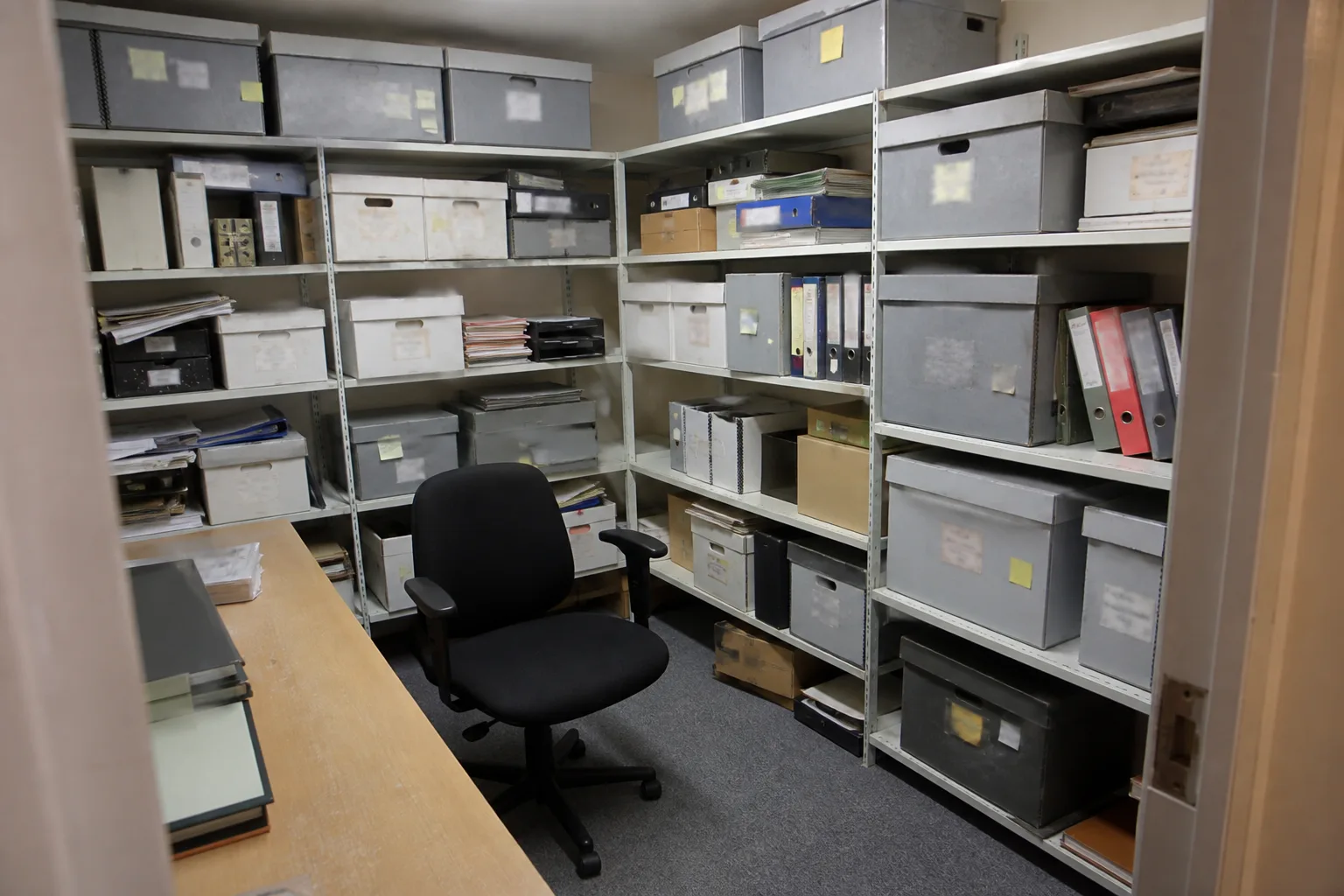 Illustrative archive room before and after confidential document collection — before